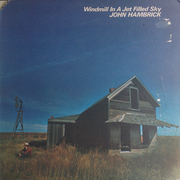 John Hambrick : Windmill In A Jet Filled Sky (LP, Album, Gat)