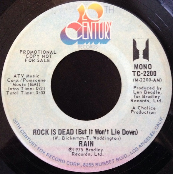 Rain (17) : Rock Is Dead (But It Won't Lie Down) (7", Mono, Promo)