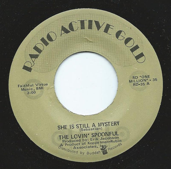 The Lovin' Spoonful : She Is Still A Mystery  (7", Single, RE)
